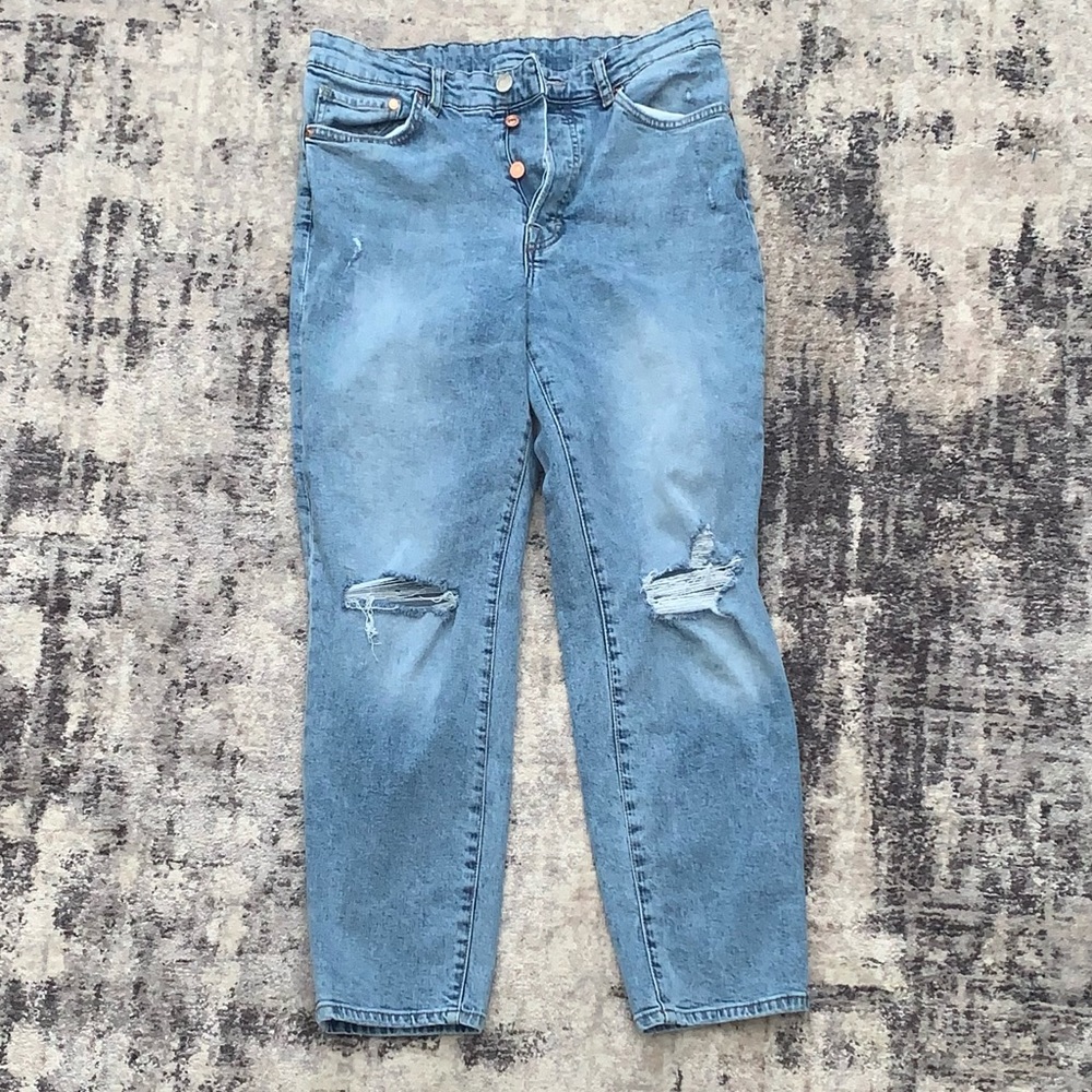 Lightly ripped ultra high waisted mom jeans.